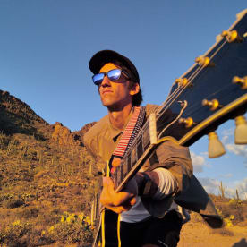 Delicate Steve Performs New Song "Green" Alone In The Desert, Watch + Listen Now